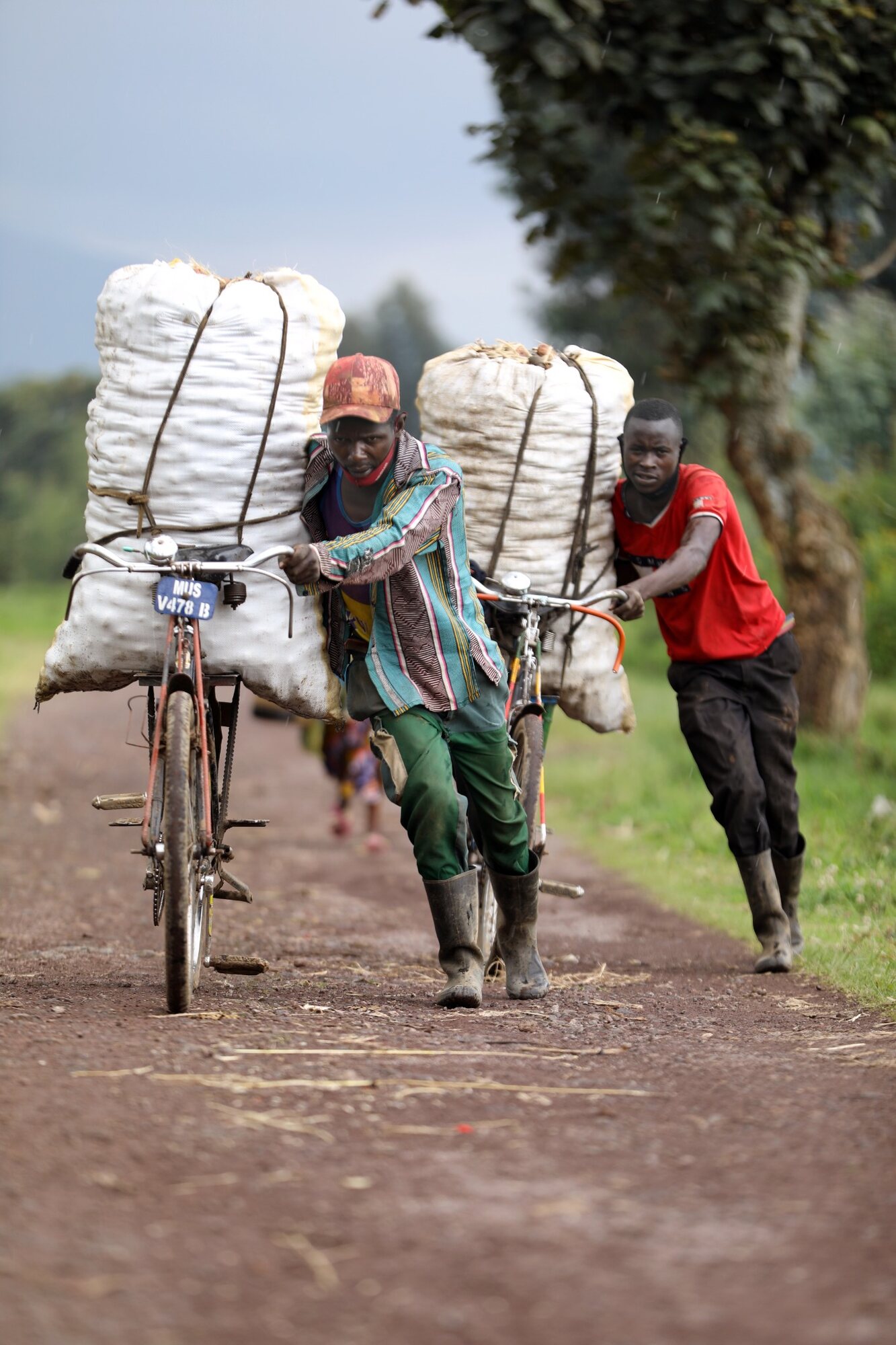 People transporting goods by bicycle photographed by Corey Fader