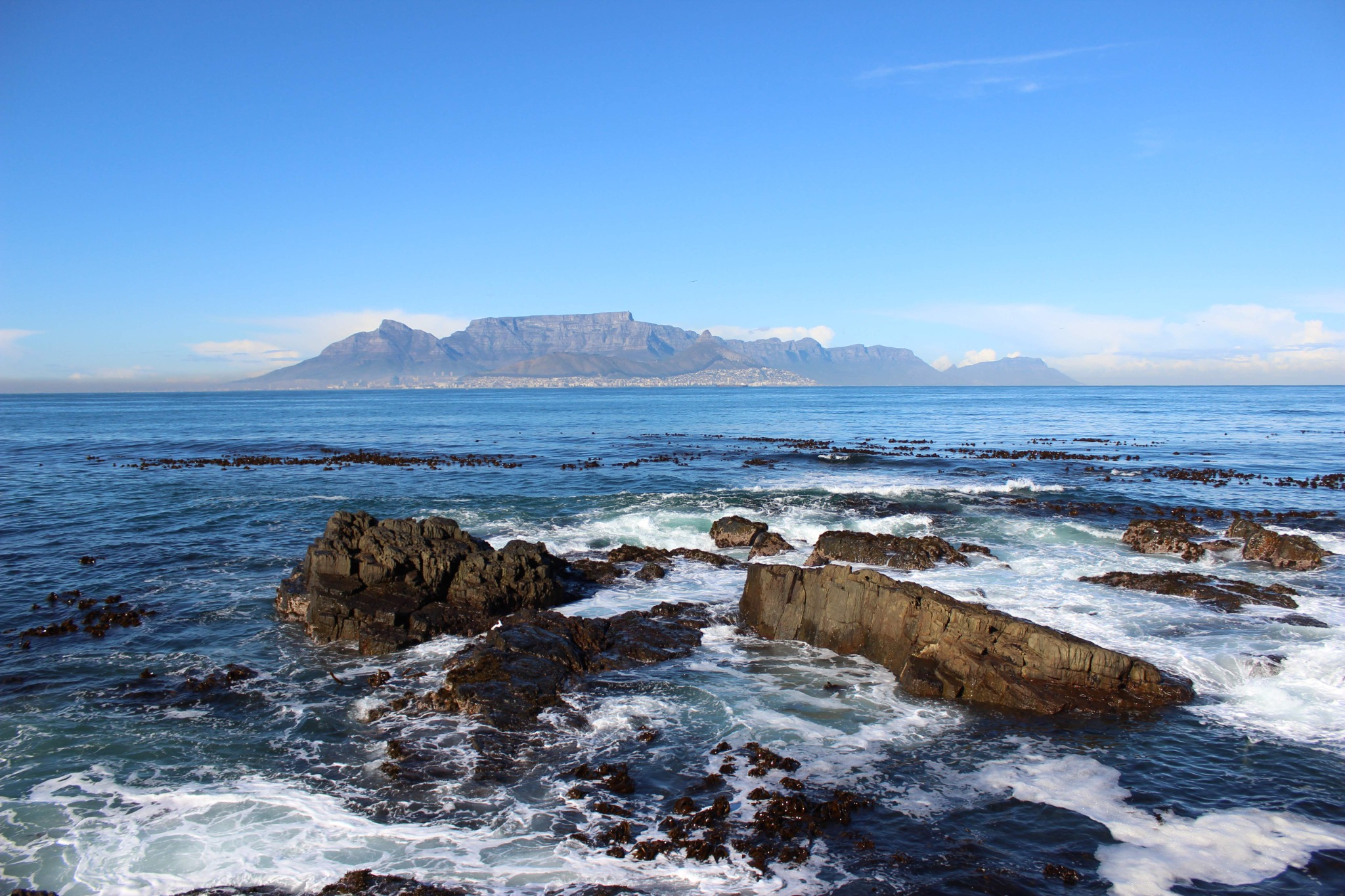 Ocean and mountain landscape photographed by Corey Fader