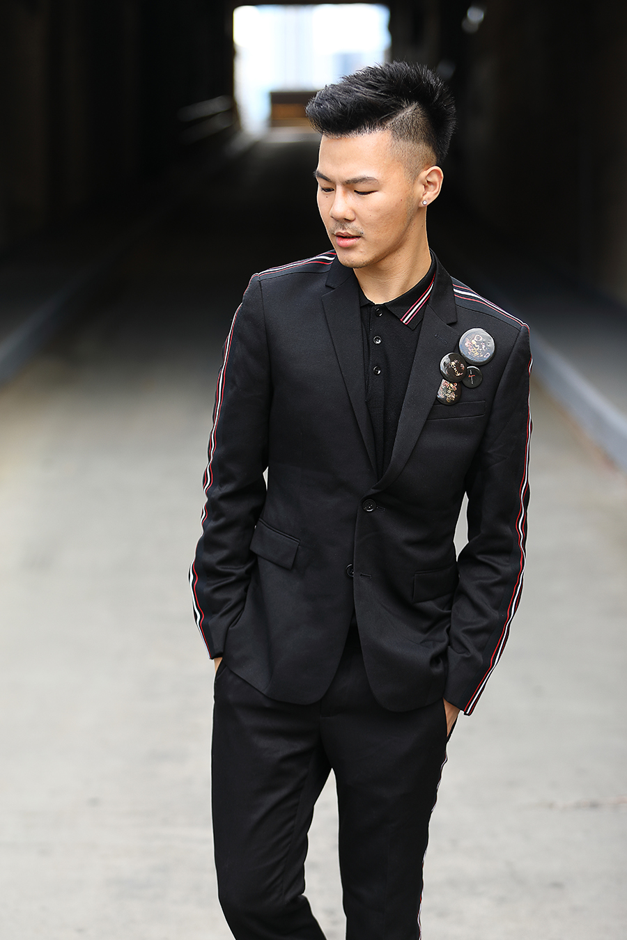 Man in a black suit photographed by Corey Fader